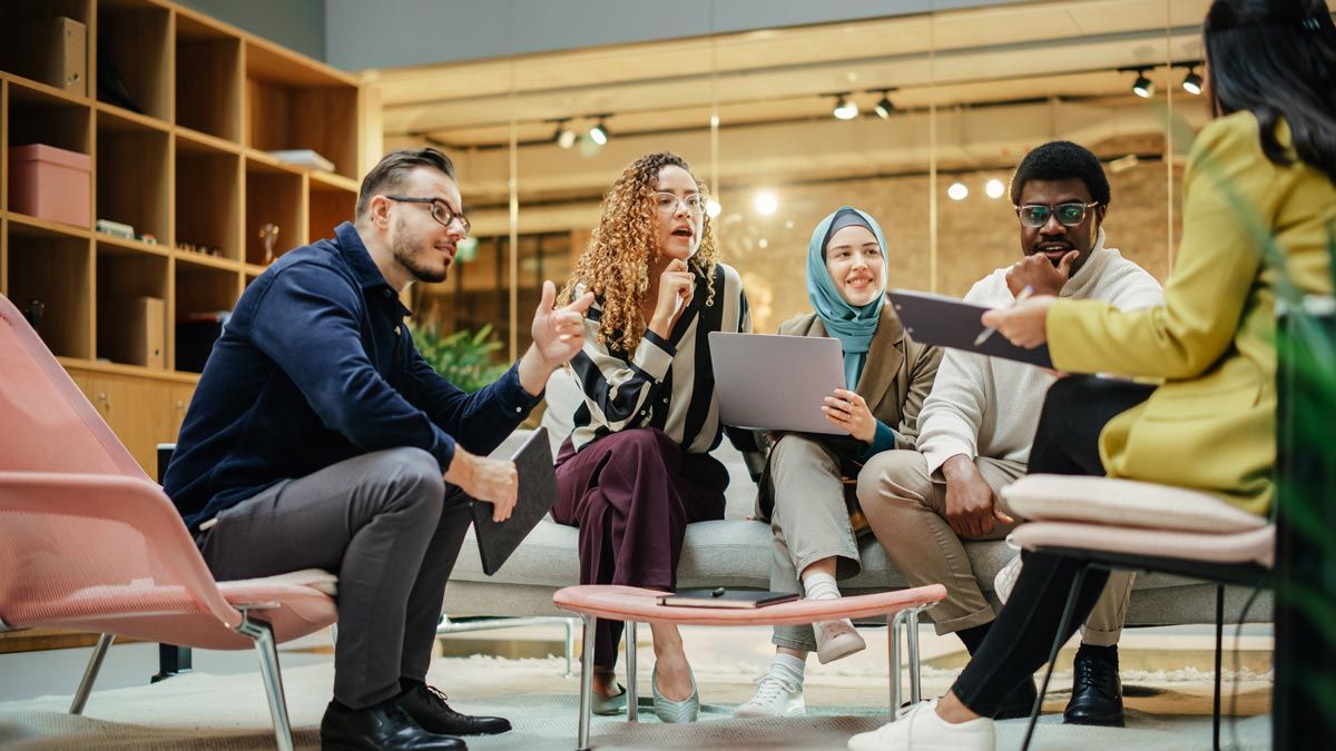 business employees in work training session having discussion in relaxed setting